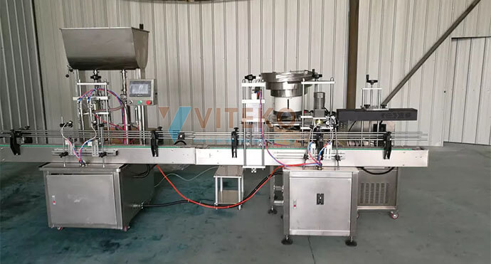 Máy chiết rót và đóng nắp chai tự động